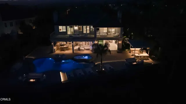a living room with furniture and painting on the wall