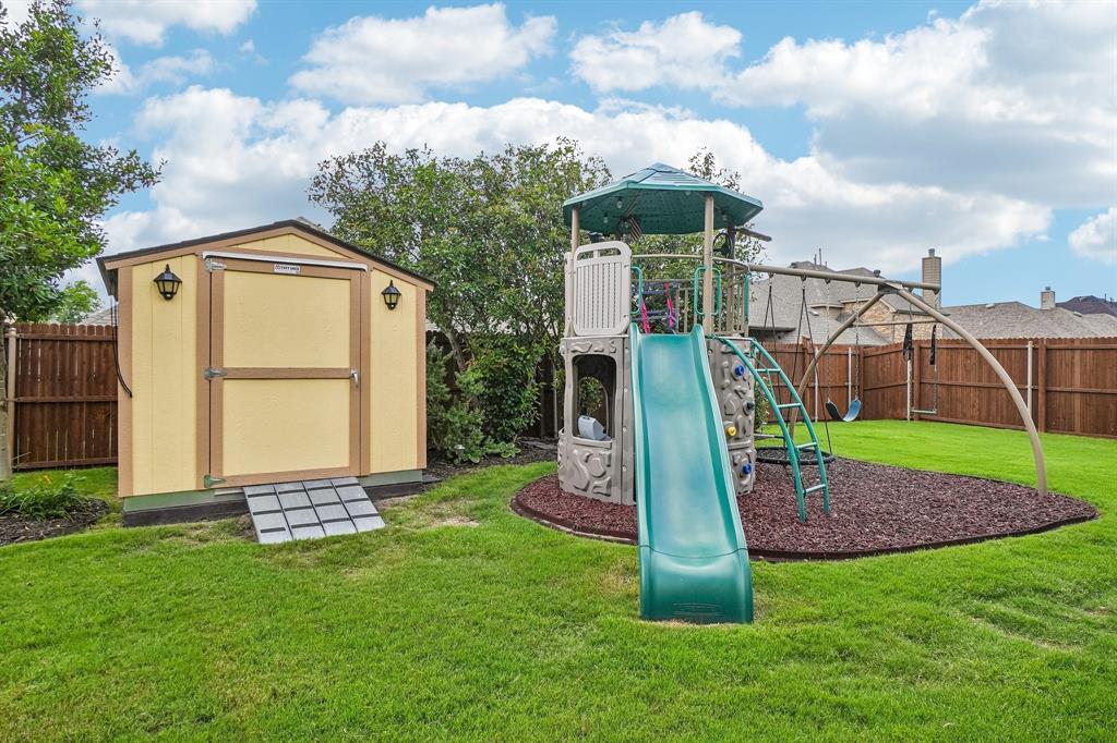 1119 Highgate Road Forney, TX 75126 - Photo 31 of 40 Backyard Shed and Play area