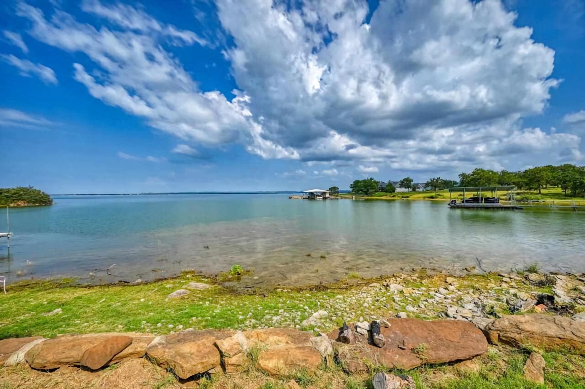 3315 Sunset Cliff Road Burnet, TX 78611 - Photo 2 of 9 a view of a lake with houses in the back