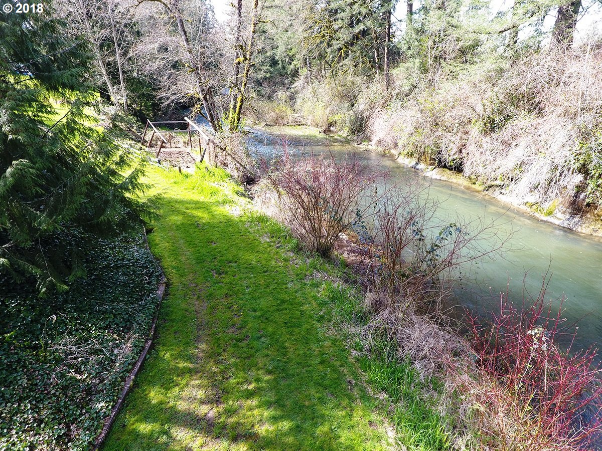 21953 South Redland Road Estacada, OR 97023 - Photo 4 of 25 a view of a lake with a yard