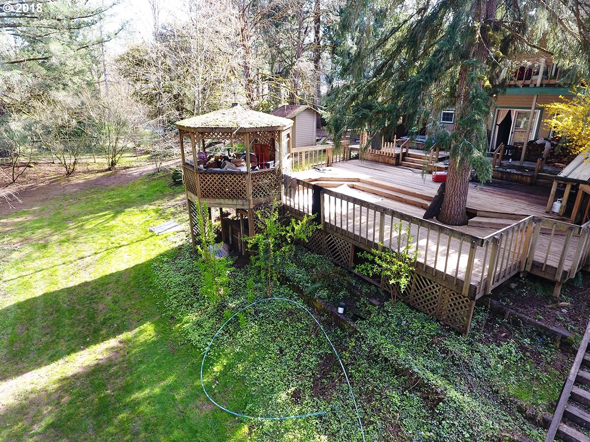 21953 South Redland Road Estacada, OR 97023 - Photo 7 of 25 a view of a patio with couches chairs and a yard