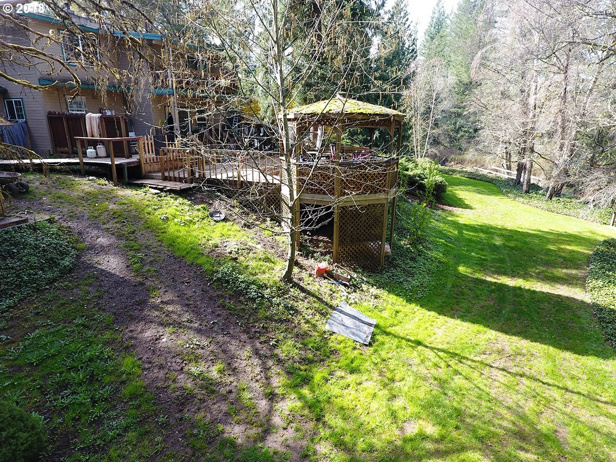 21953 South Redland Road Estacada, OR 97023 - Photo 8 of 25 a view of a garden with large trees