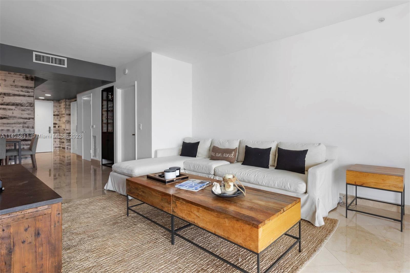 a living room with furniture and a table