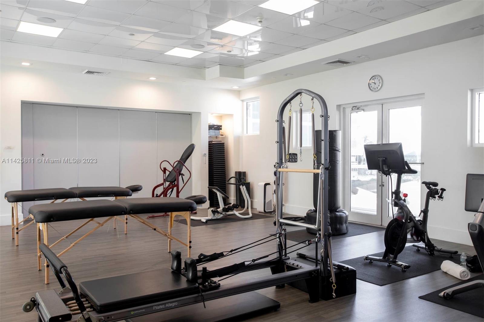 4779 Collins Avenue, Unit 1908 Miami Beach, FL 33140 - Photo 25 of 36 a view of a room with gym equipment