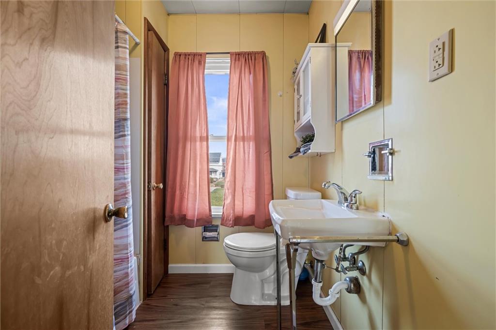 325 Walnut Street Vandergrift, PA 15690 - Photo 16 of 29 a bathroom with a sink toilet and shower