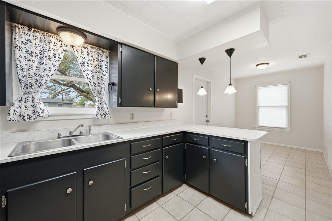 804 Edwards Street Sinton, TX 78387 - Photo 11 of 25 a kitchen with a sink and a window