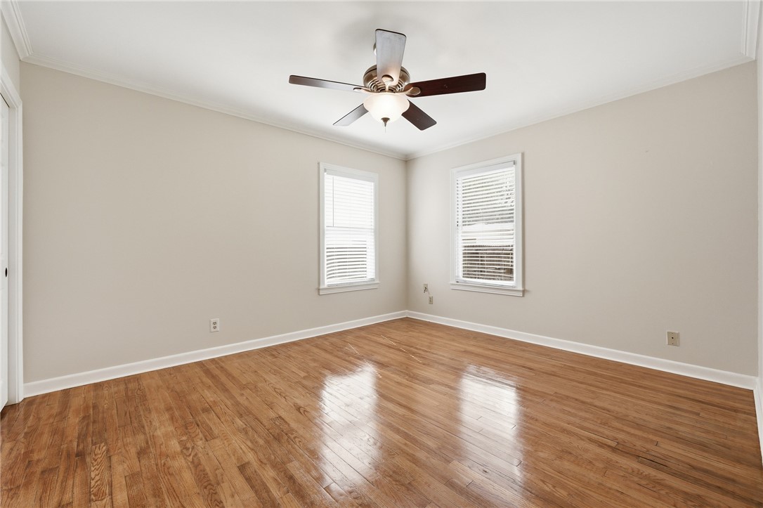 804 Edwards Street Sinton, TX 78387 - Photo 15 of 25 a view of an empty room with wooden floor and a window