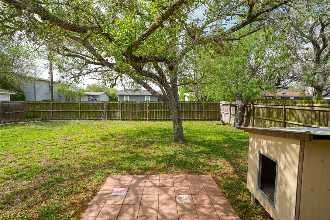804 Edwards Street Sinton, TX 78387 - Photo 20 of 25 a view of a yard with plants and large trees