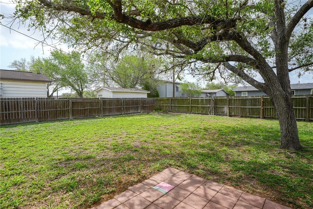 804 Edwards Street Sinton, TX 78387 - Photo 22 of 25 a view of a yard with a large tree