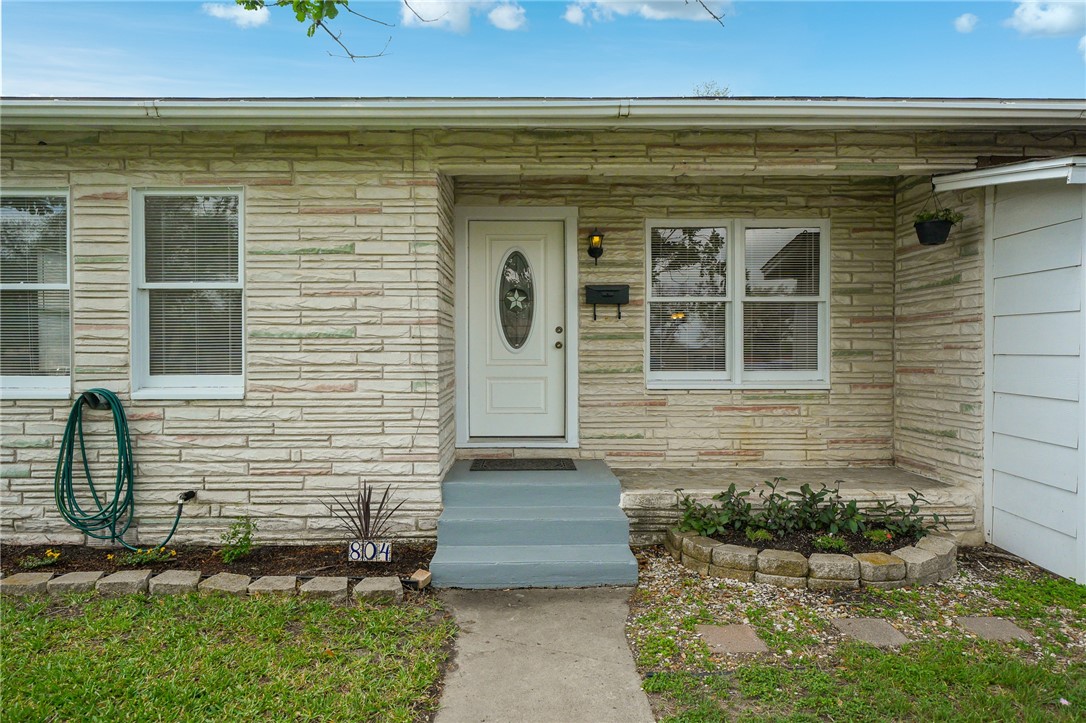 804 Edwards Street Sinton, TX 78387 - Photo 3 of 25 a front view of a house with a yard