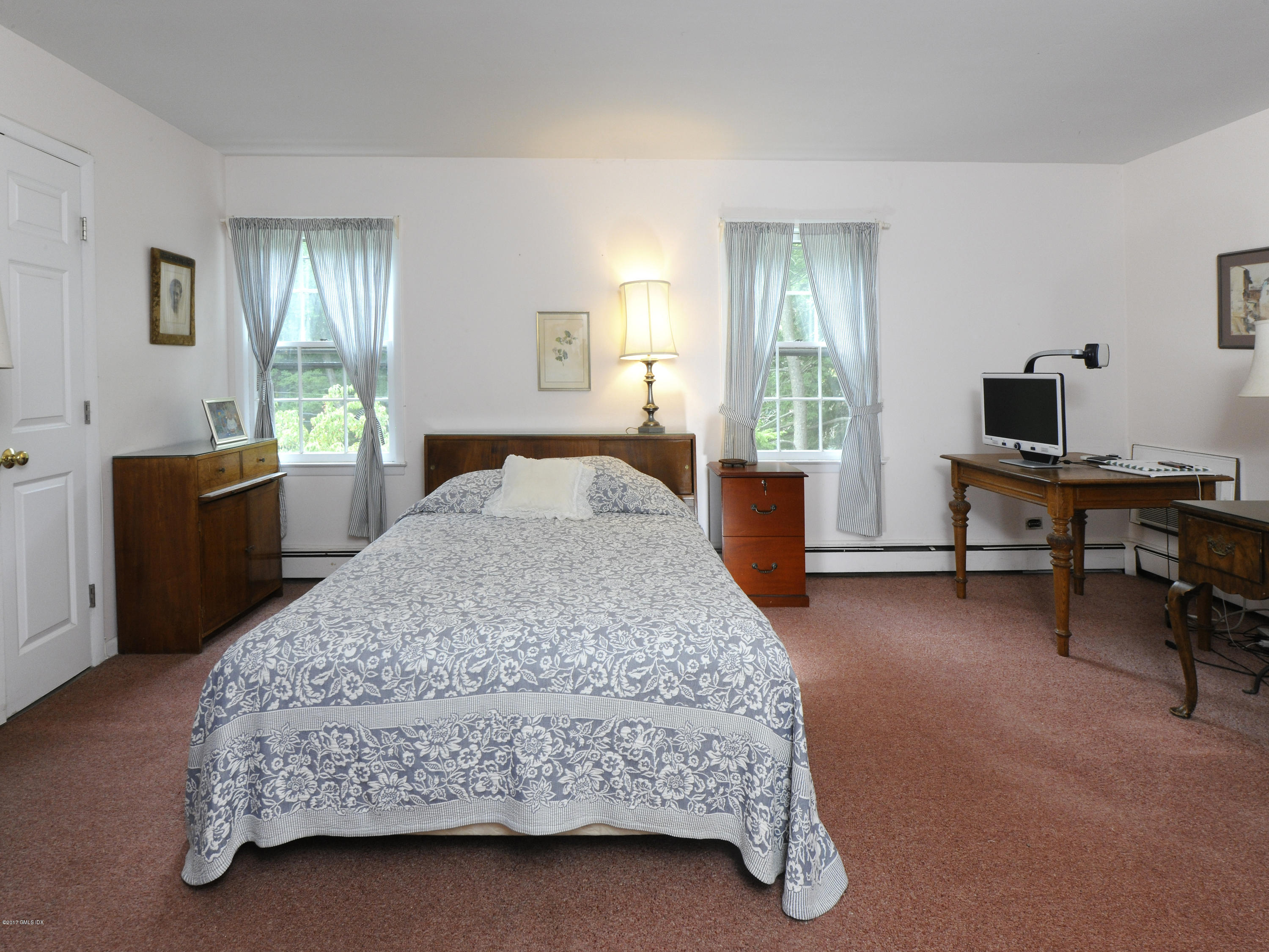 2 Hunting Ridge Road Greenwich, CT 06831 - Photo 10 of 14 a bedroom with a bed and a desk in it