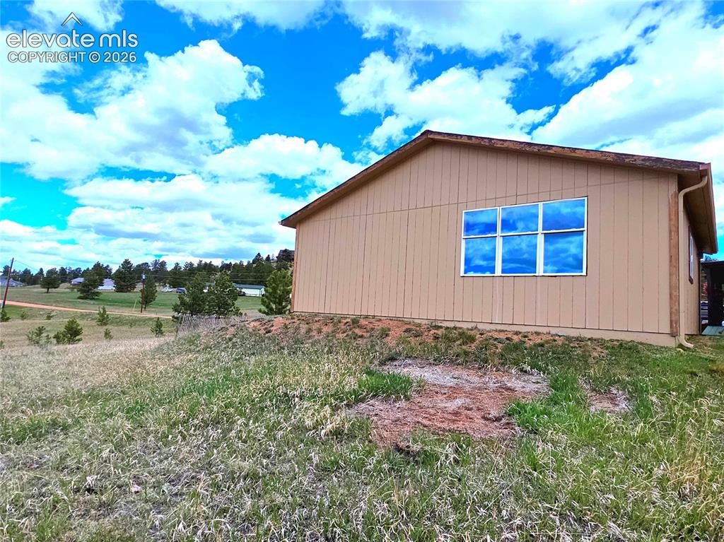 891 North Mountain Estates Road Florissant, CO 80816 - Photo 39 of 49 Great natural lighting in the oversized, heated, insulated and walled for the hobbyist. Nice views from the open doors too