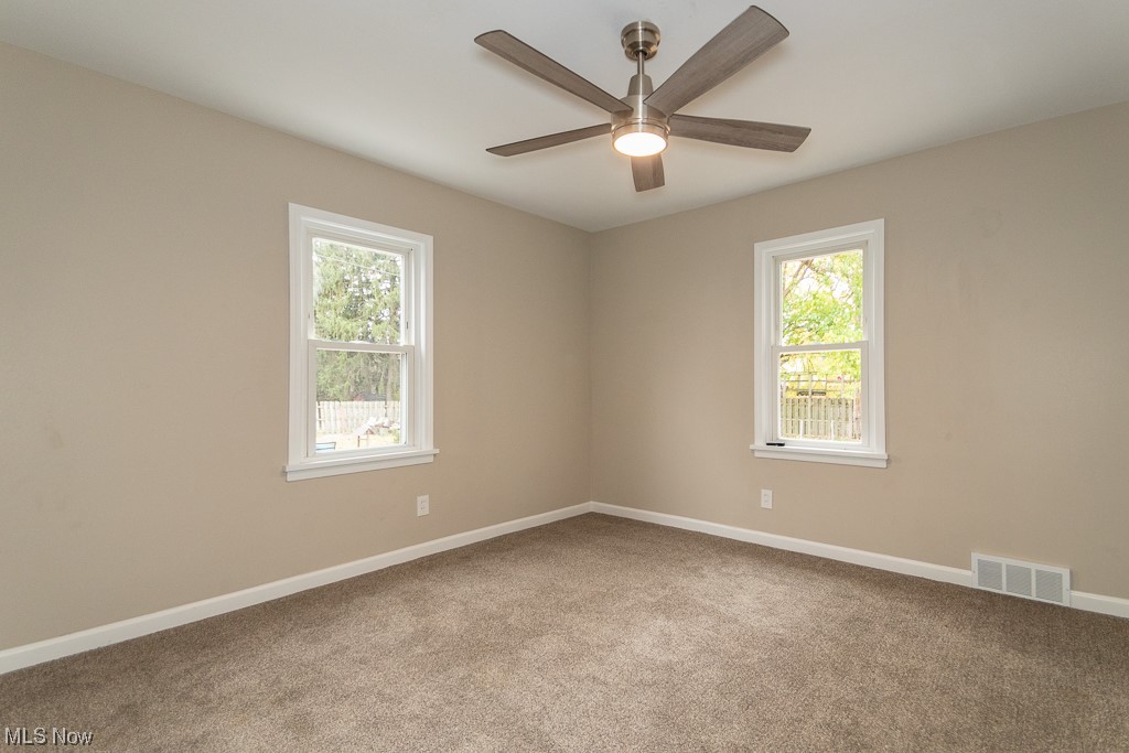 2252 Rockefeller Road Wickliffe, OH 44092 - Photo 15 of 23 Carpeted empty room with ceiling fan