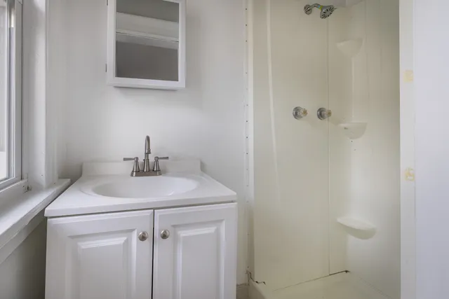 a bathroom with a sink toilet and vanity