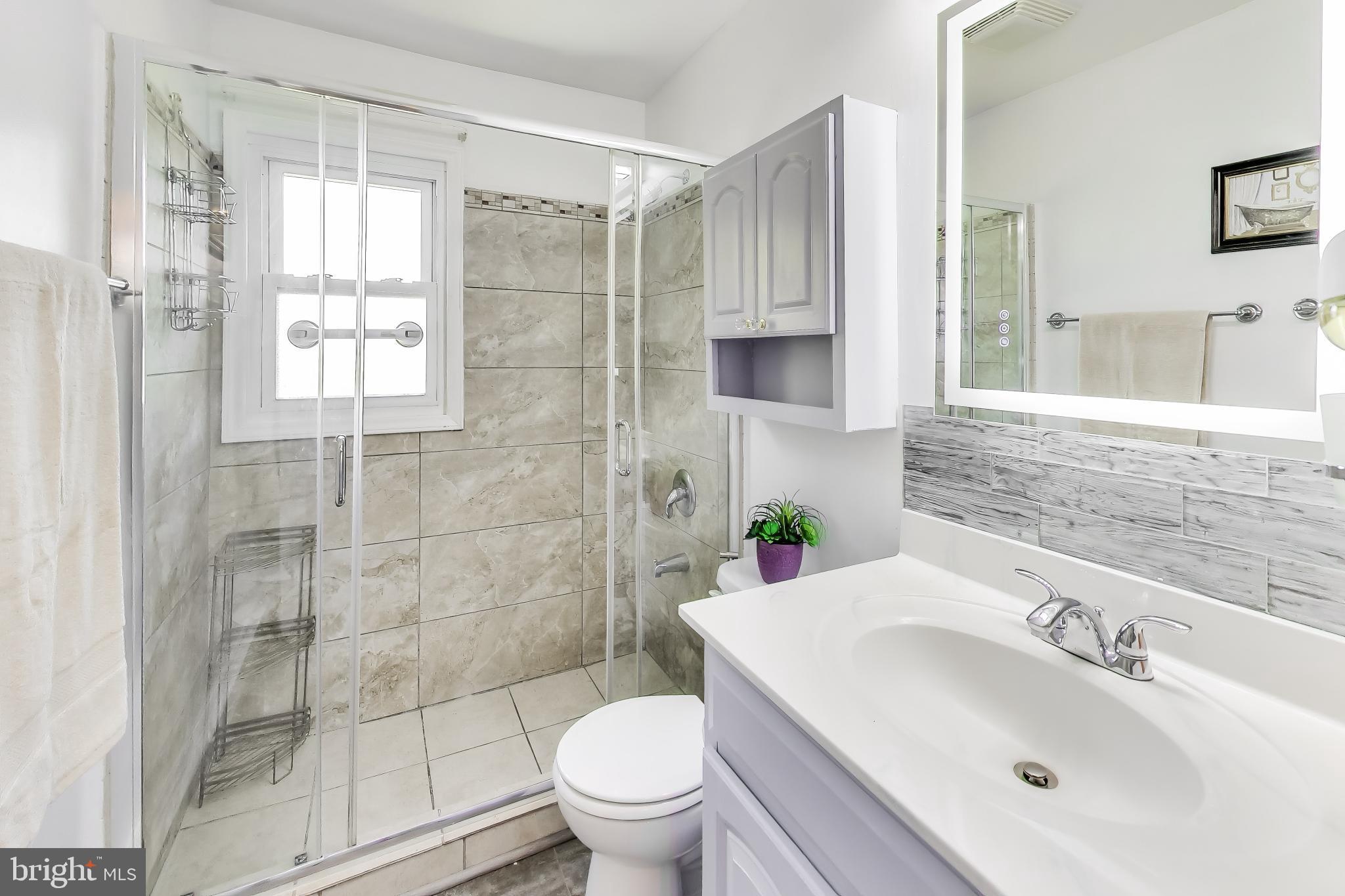 1304 Columbia Road Woodbridge, VA 22191 - Photo 20 of 50 Modern bathroom with sleek design.
