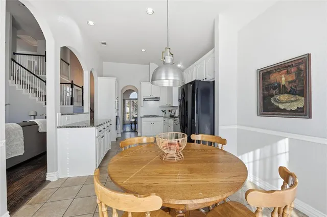 a view of a kitchen with furniture and a chandelier