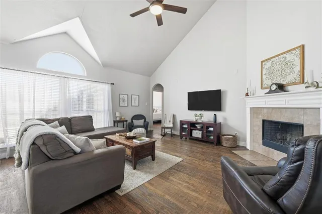 a living room with furniture fireplace and flat screen tv