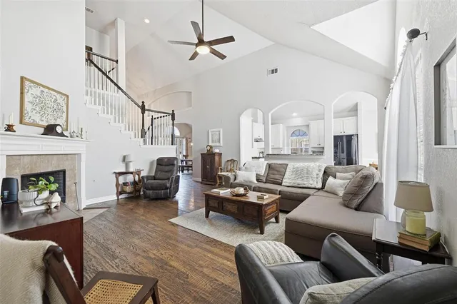 a living room with furniture and a fireplace