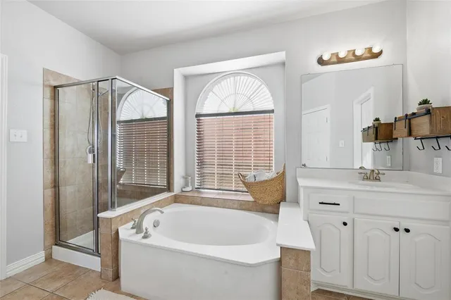 a bath tub sitting next to a white sink