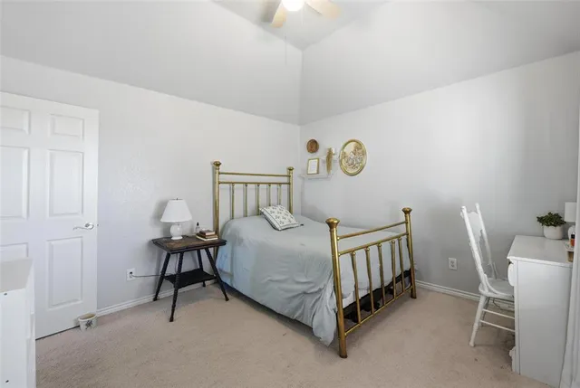 a bedroom with a bed and a table in it