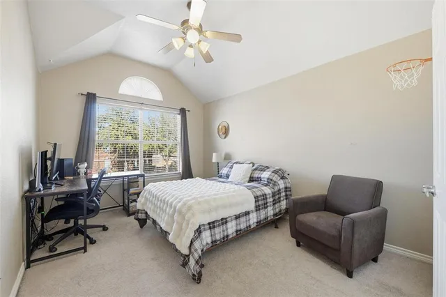 a bedroom with a bed and a couch