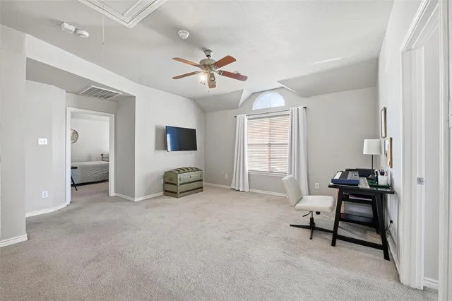 a view of a livingroom with furniture and a window