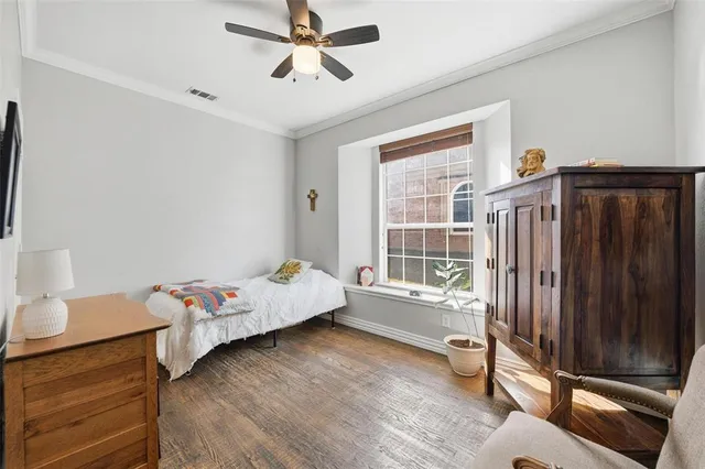 a bedroom with furniture and a window