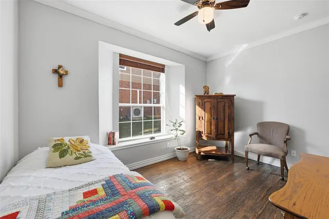 a bedroom with a bed and a chair