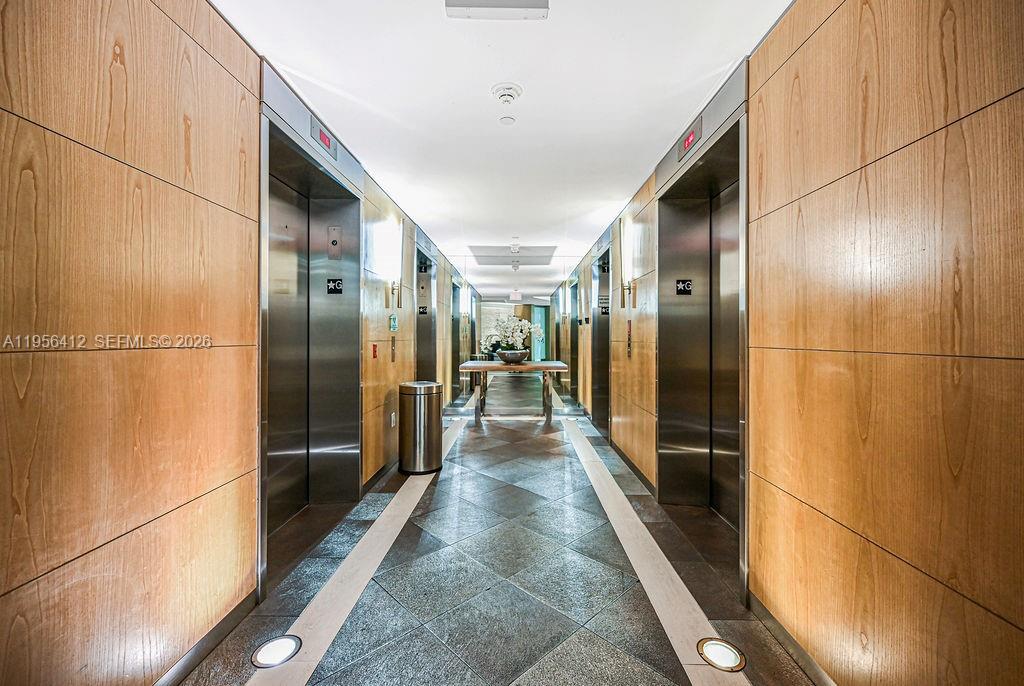 92 Southwest 3rd Street, Unit 4806 Miami, FL 33130 - Photo 18 of 20 a view of a hallway with wooden floor