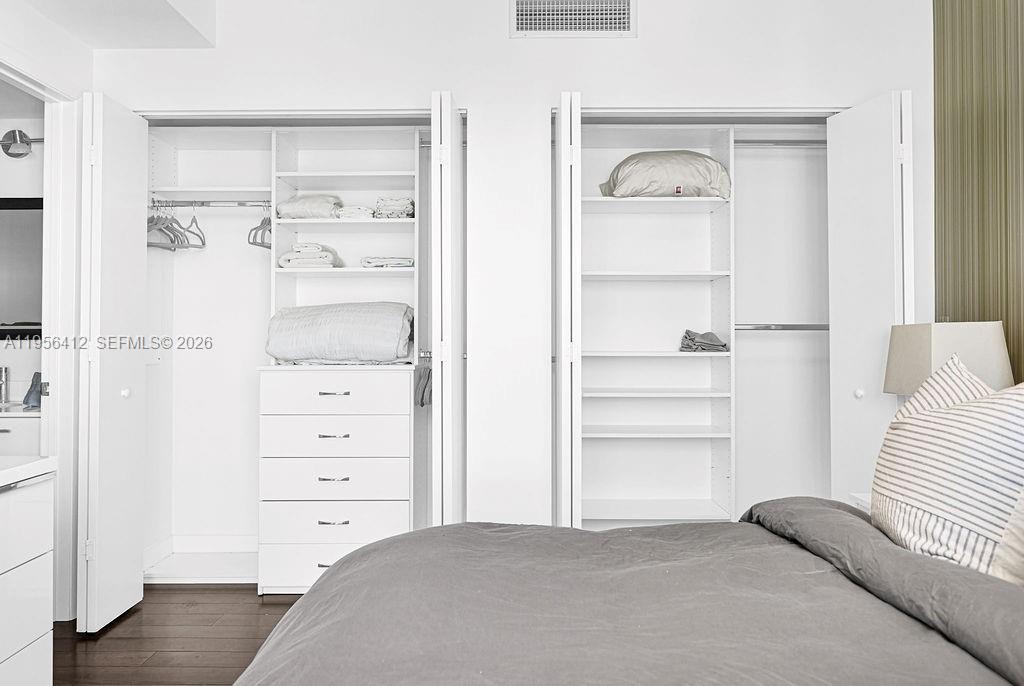 92 Southwest 3rd Street, Unit 4806 Miami, FL 33130 - Photo 9 of 20 a bedroom with a bed and a closet