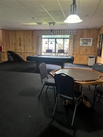 a view of a dining room with furniture and window