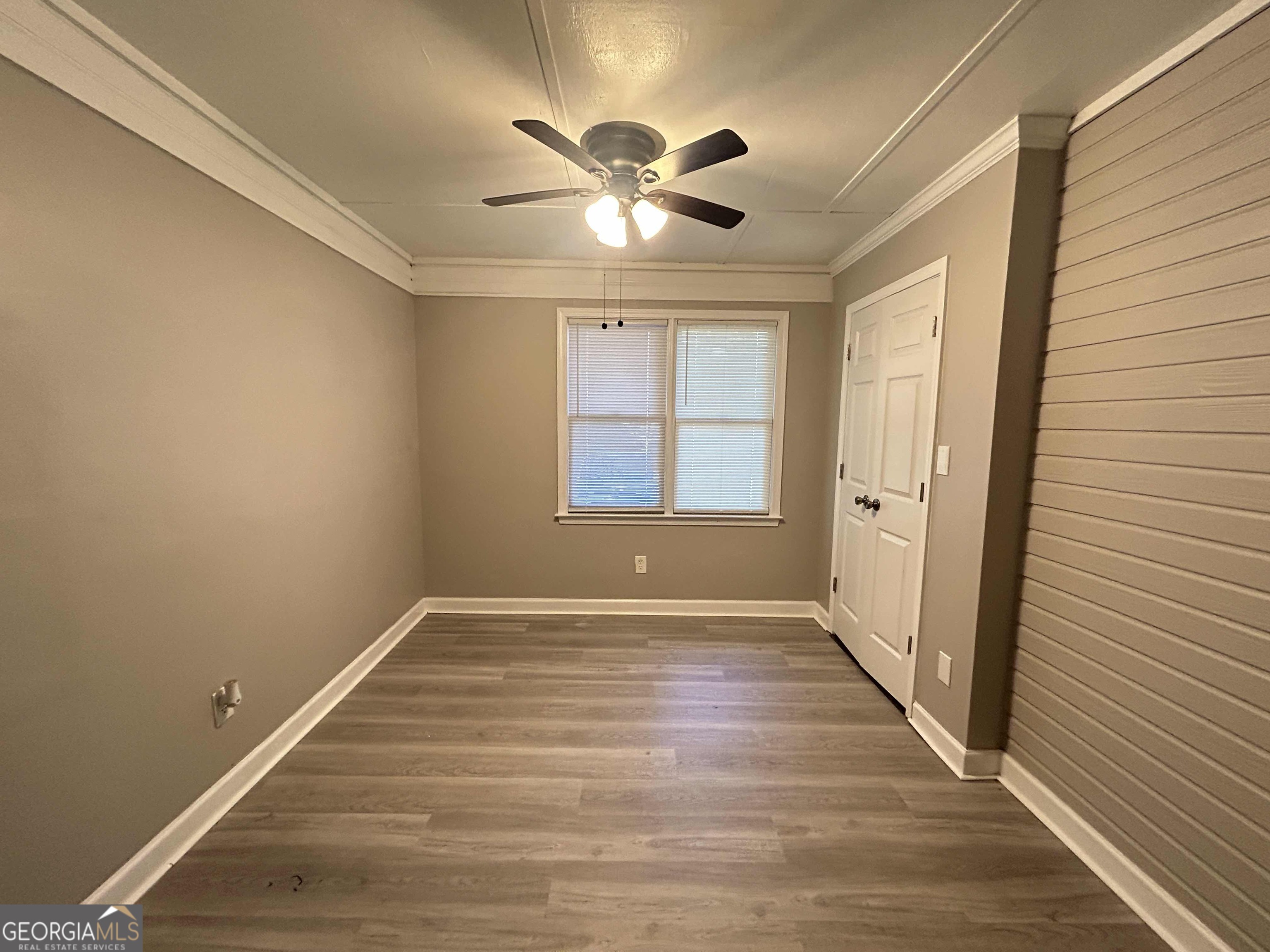 8937 Tweeddale Drive Winston, GA 30187 - Photo 15 of 26 wooden floor in an empty room with a window