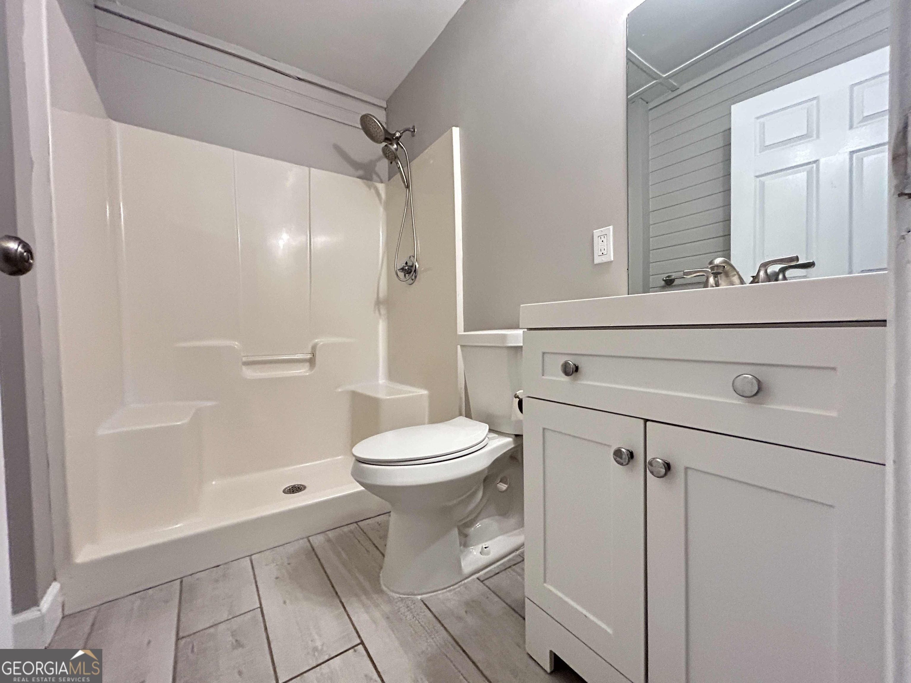 8937 Tweeddale Drive Winston, GA 30187 - Photo 16 of 26 a bathroom with a toilet a sink and shower