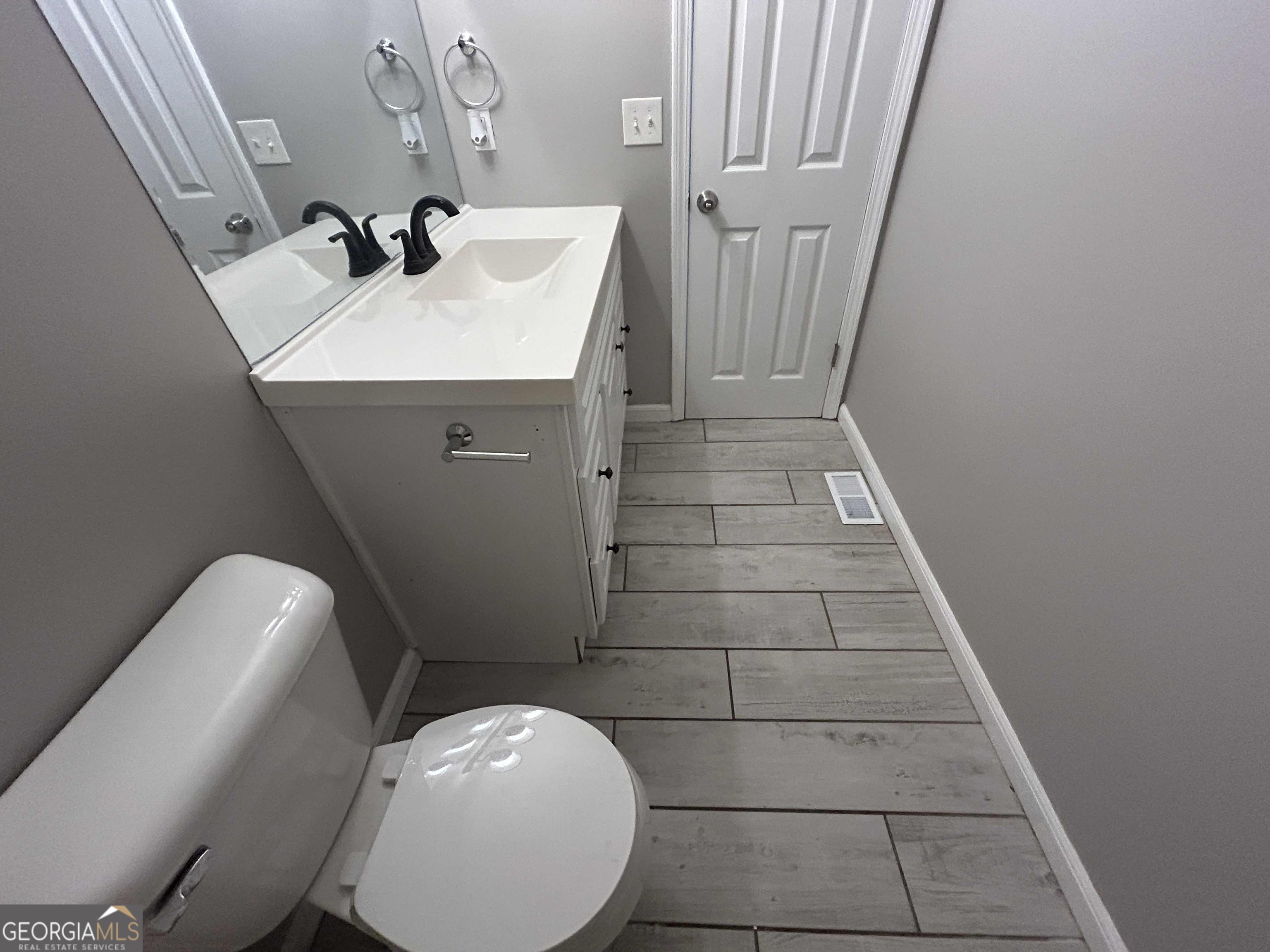 8937 Tweeddale Drive Winston, GA 30187 - Photo 17 of 26 a bathroom with a sink and mirror