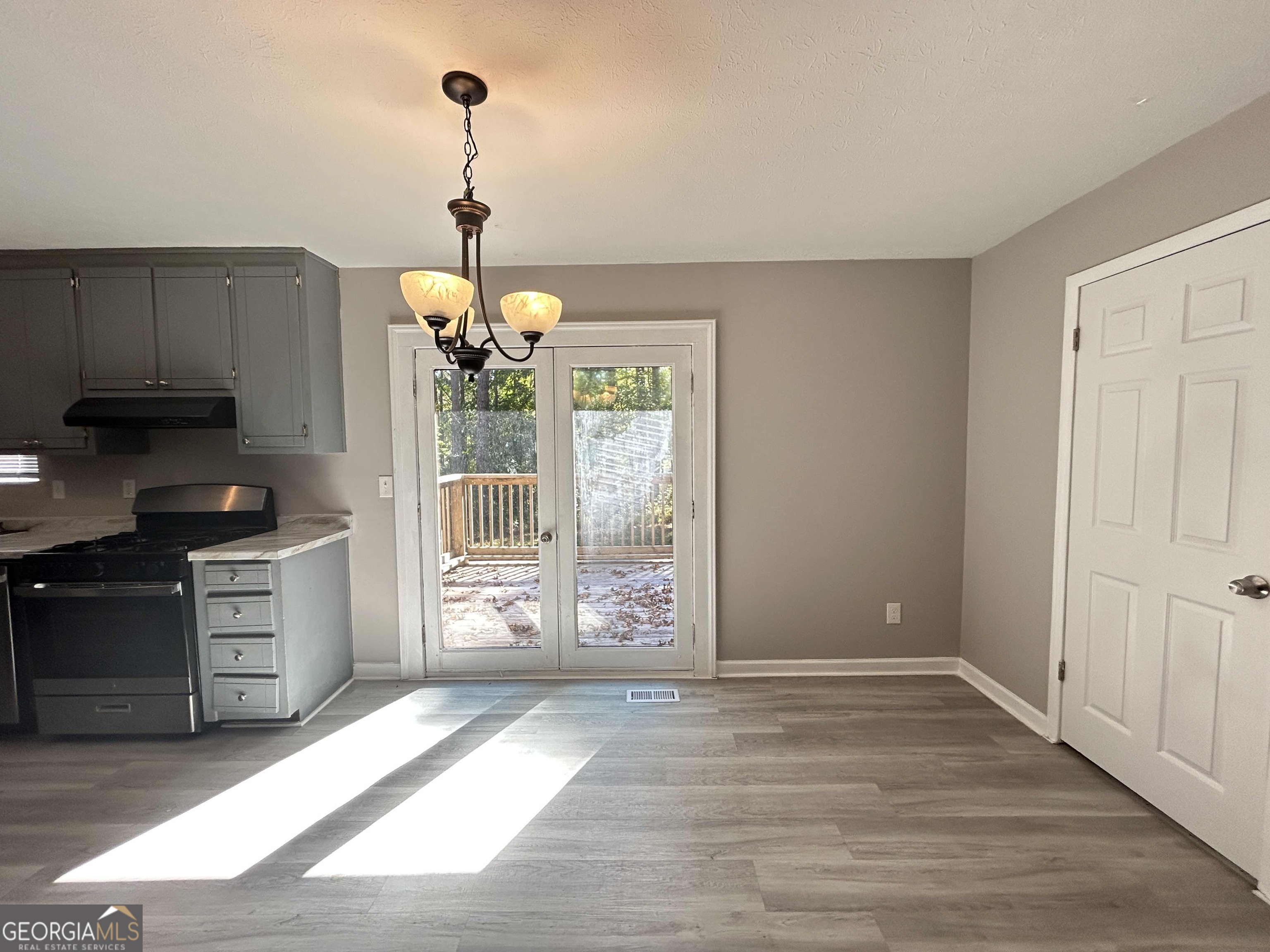 8937 Tweeddale Drive Winston, GA 30187 - Photo 4 of 26 a kitchen with a refrigerator and a stove top oven