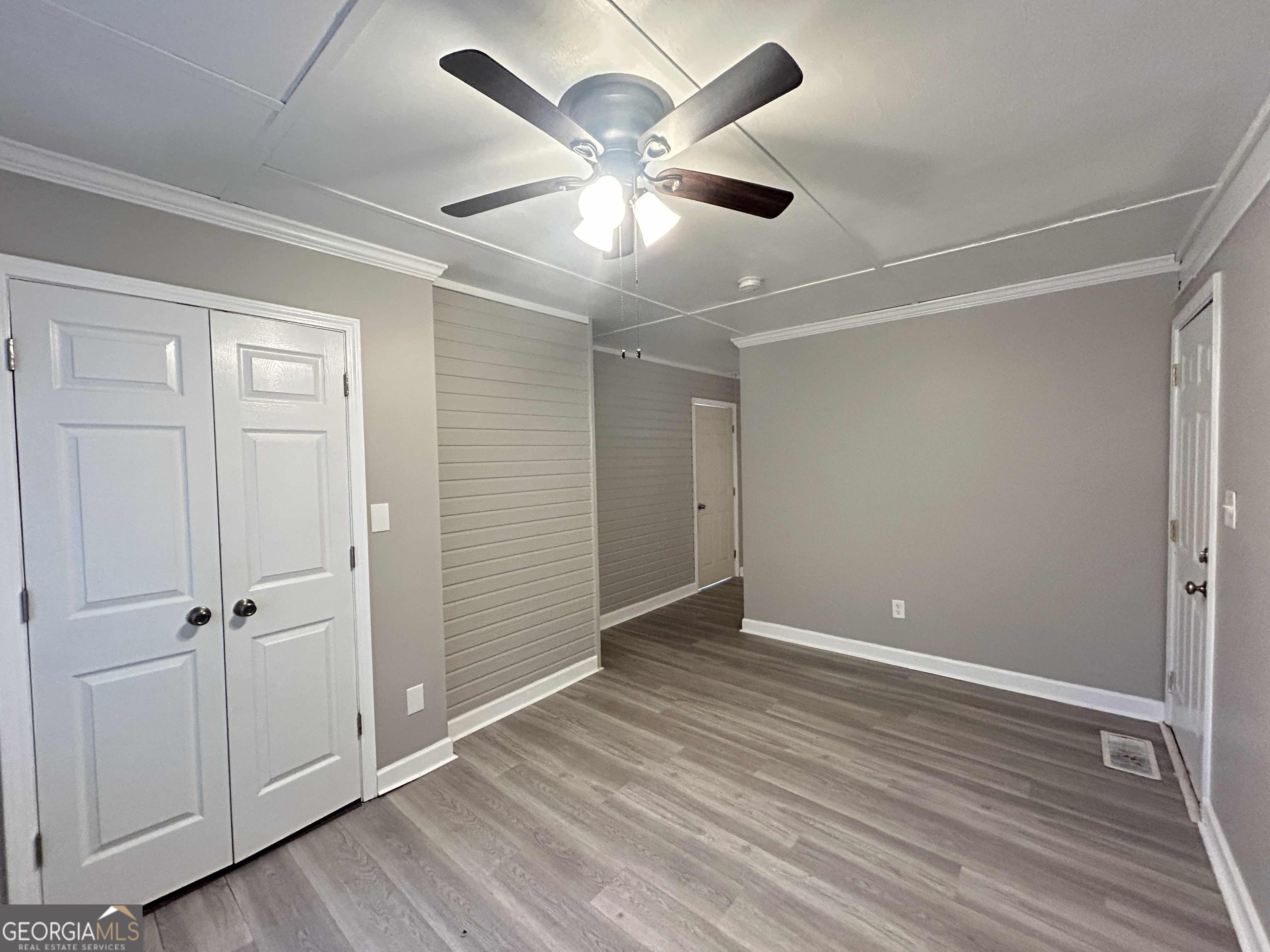 8937 Tweeddale Drive Winston, GA 30187 - Photo 7 of 26 a view of an empty room with wooden floor