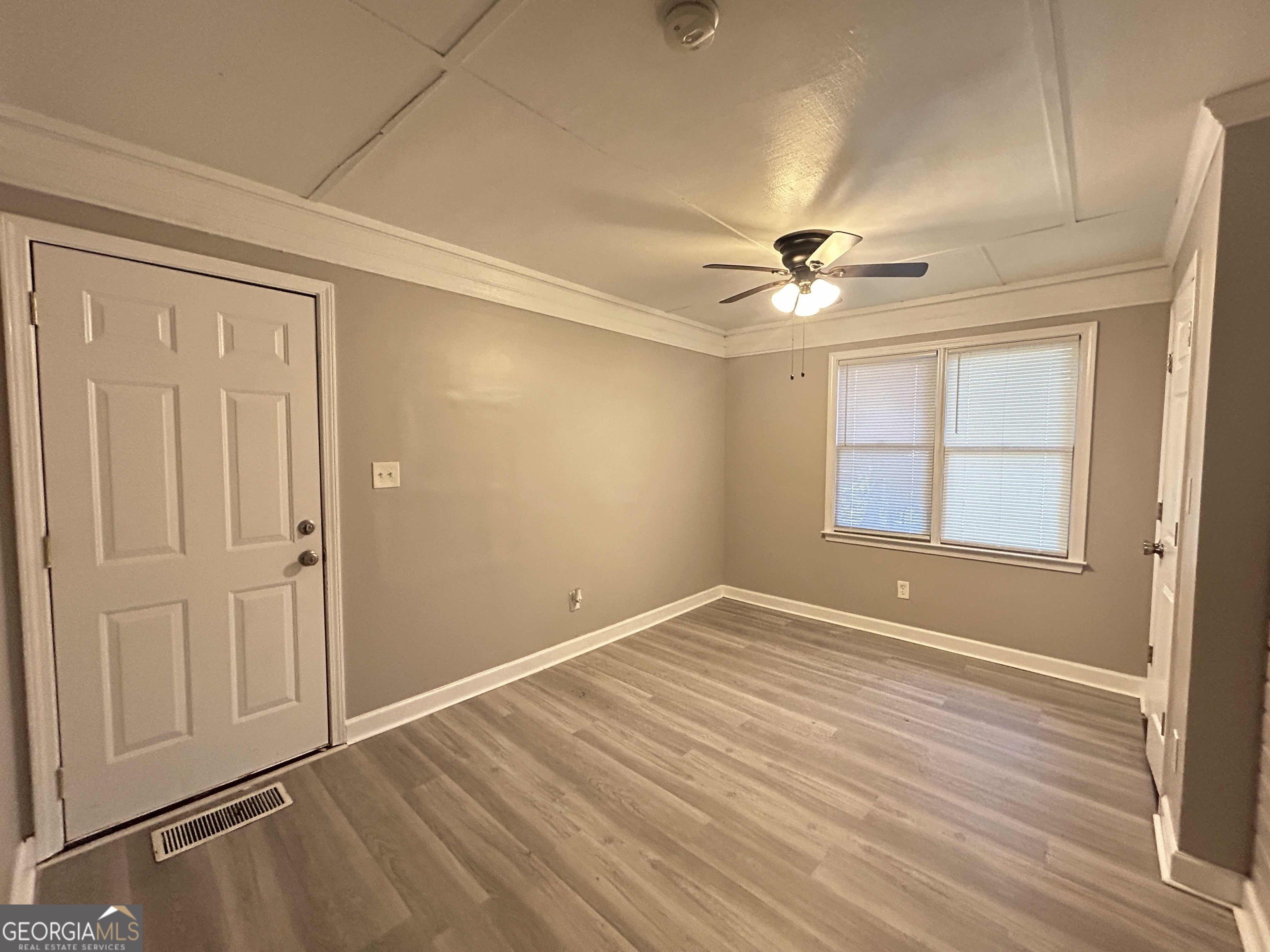 8937 Tweeddale Drive Winston, GA 30187 - Photo 9 of 26 wooden floor in an empty room with a window