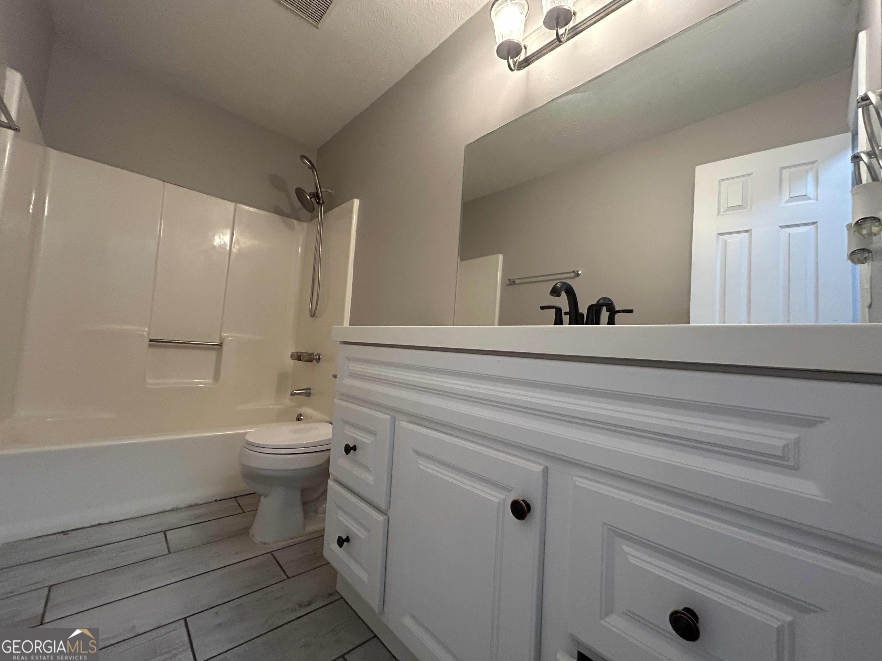 8937 Tweeddale Drive Winston, GA 30187 - Photo 10 of 26 a bathroom with a sink a toilet and a bathtub