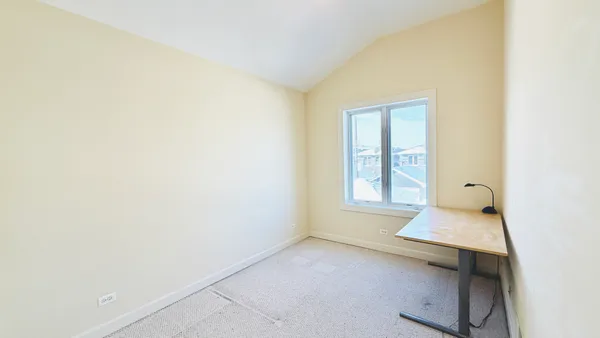 a view of an empty room and window