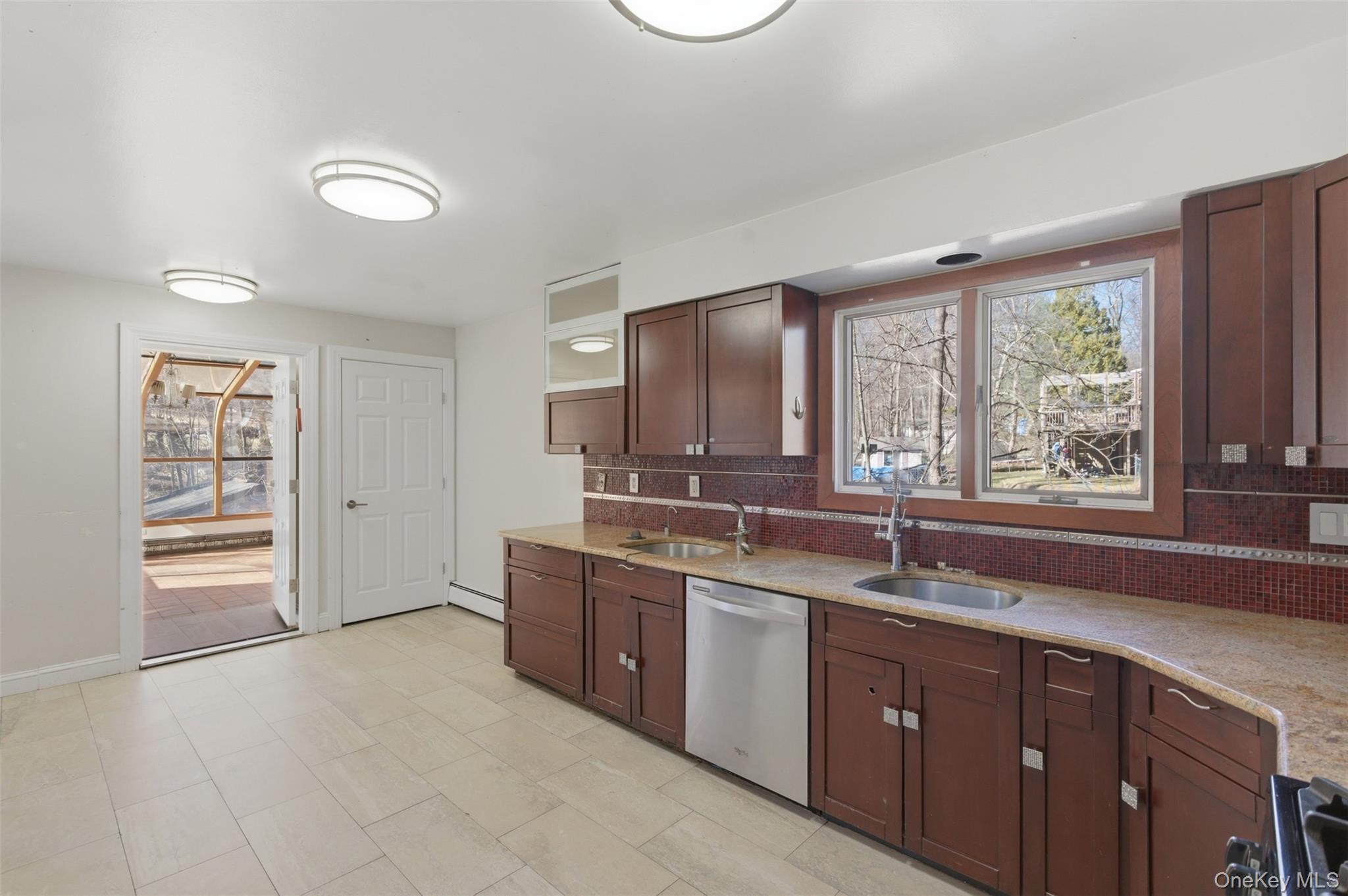 41 South Monsey Road Monsey, NY 10952 - Photo 17 of 50 a kitchen with a sink and large window