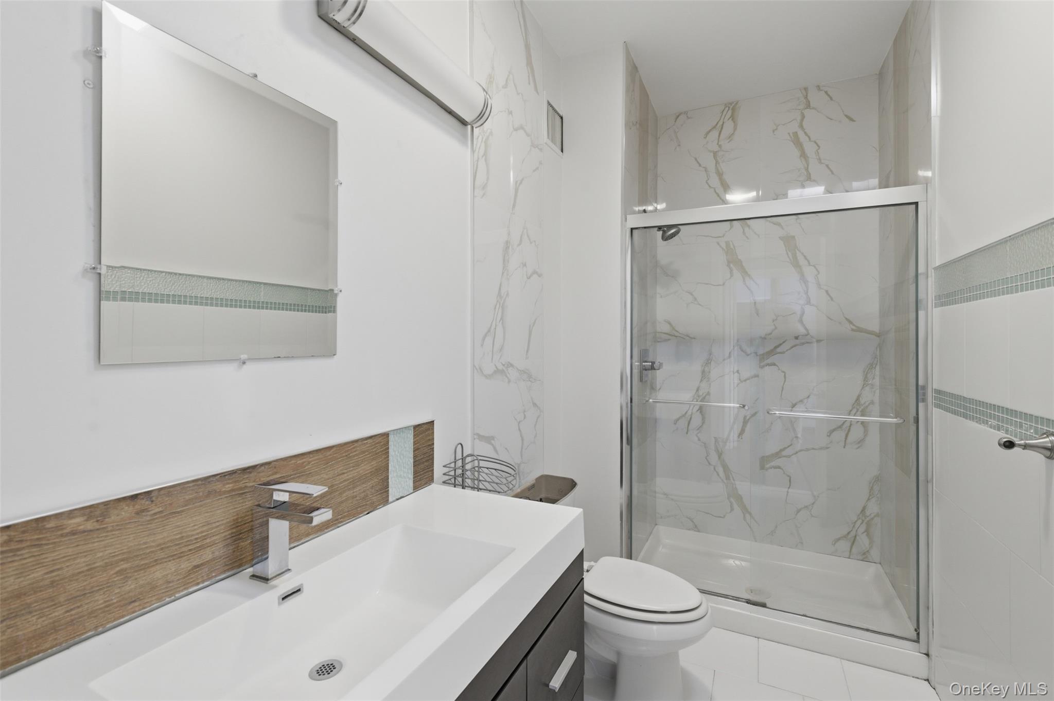 41 South Monsey Road Monsey, NY 10952 - Photo 24 of 50 a bathroom with a sink toilet and shower