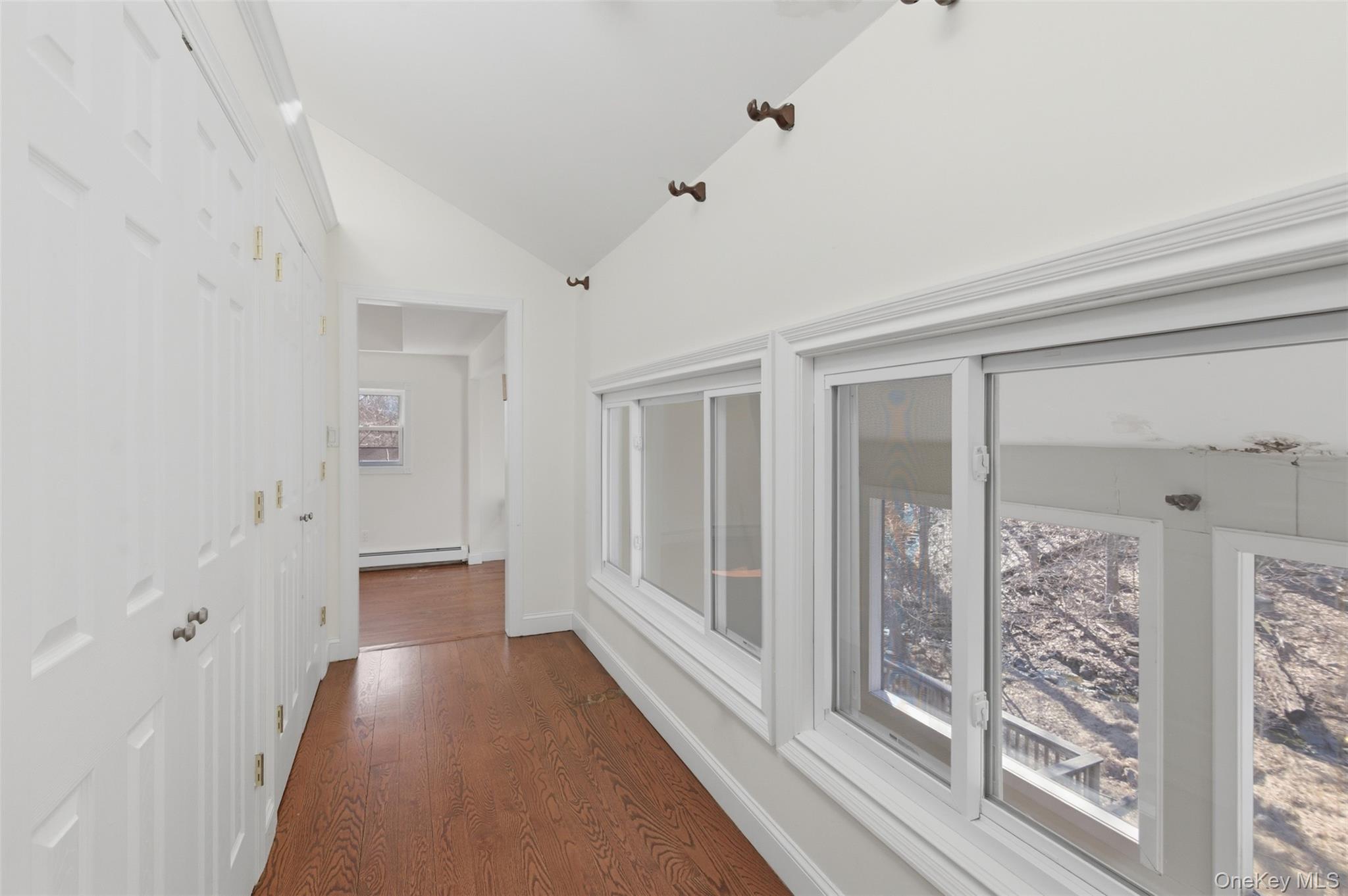 41 South Monsey Road Monsey, NY 10952 - Photo 25 of 50 a view of a hallway with wooden floor and windows