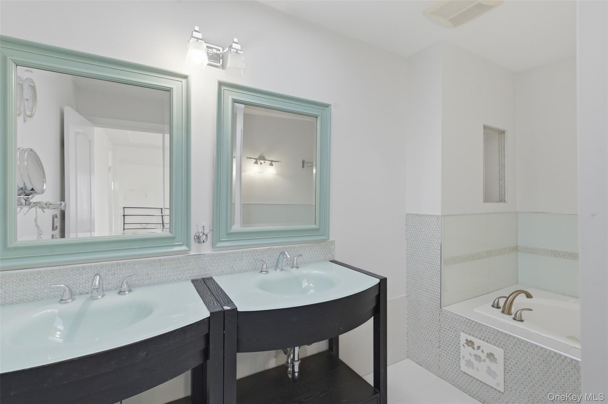 41 South Monsey Road Monsey, NY 10952 - Photo 29 of 50 a bathroom with a sink vanity granite tub and a mirror