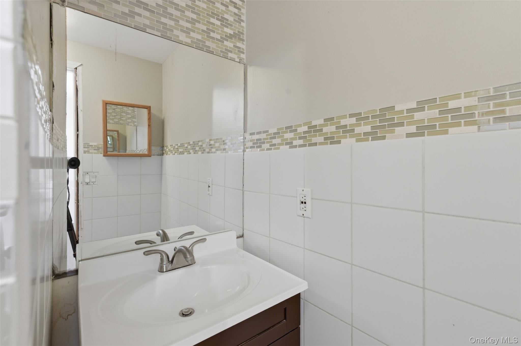 41 South Monsey Road Monsey, NY 10952 - Photo 34 of 50 a bathroom with a sink and mirror