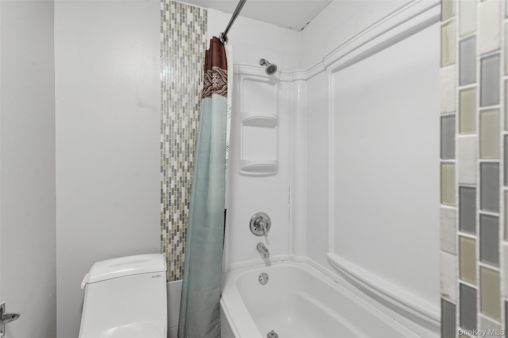 41 South Monsey Road Monsey, NY 10952 - Photo 35 of 50 a bathroom with a bathtub and a shower