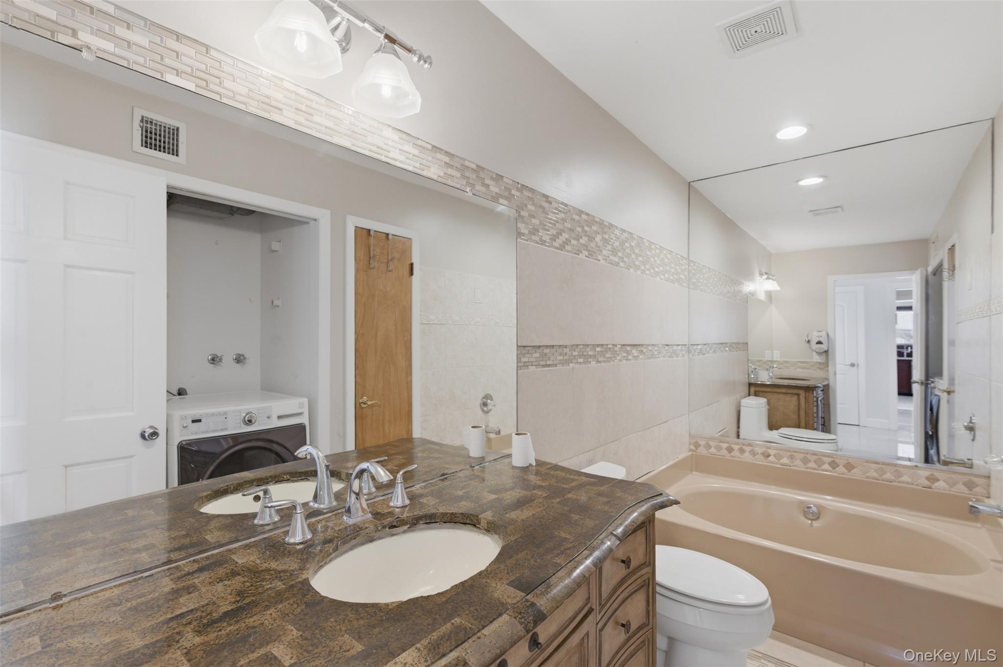 41 South Monsey Road Monsey, NY 10952 - Photo 7 of 50 a bathroom with a granite countertop sink a toilet a tub and shower