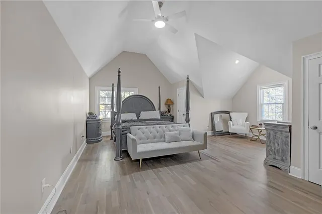 a bedroom with furniture and wooden floor