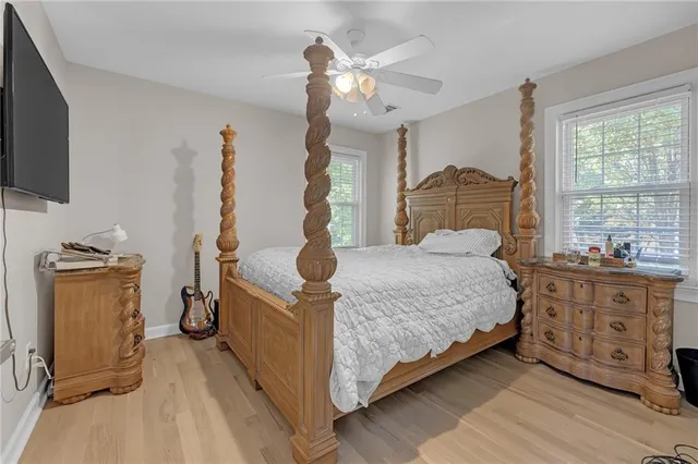 a bed room with a bed and a television