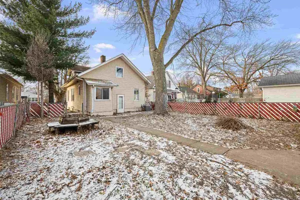 a house view with a backyard space