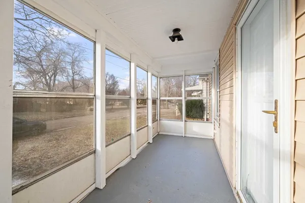 a view of a glass door with a balcony